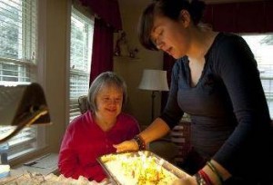 Marybeth Solinski gets ready to blow out the candles on her 59th birthday cake last fall with her niece Sarah Gaziano, 22.